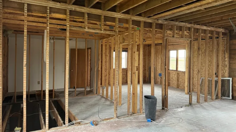 Interior demolition with timber framing exposed