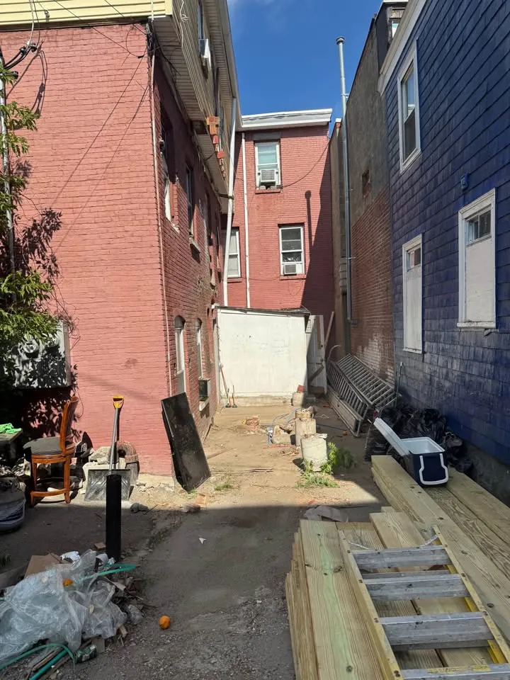 Narrow access beside buildings at a demolition work area