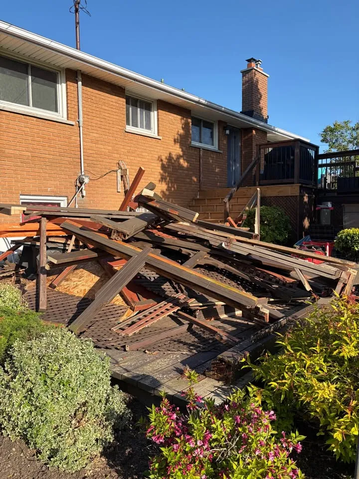Dismantled wood structure in a residential yard