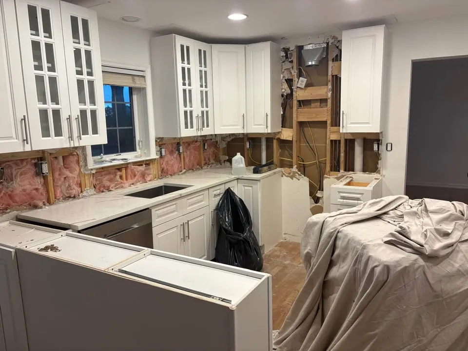 Kitchen cabinets retained beside an opened wall