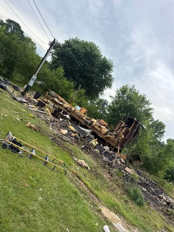 Cleared residential site with demolition material